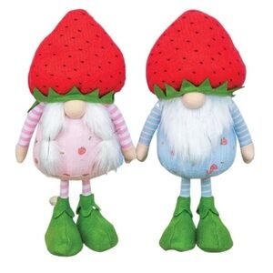 Two strawberry-themed gnomes